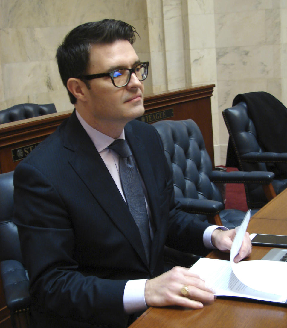 Sen. David Sanders sits at his desk ahead of a session Thursday, Jan. 26, 2017, at the State Capitol in Little Rock, Ark. Senators gave final approval to a bill that would restrict a common second-trimester abortion procedure. The Republican from Little Rock said the bill was humane and would "move us to a more compassionate society." (AP Photo/Kelly P. Kissel)