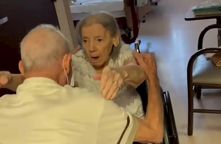 This is the adorable moment an elderly couple married for 73 years were reunited in a care home after spending nearly a whole year apart. (SWNS)