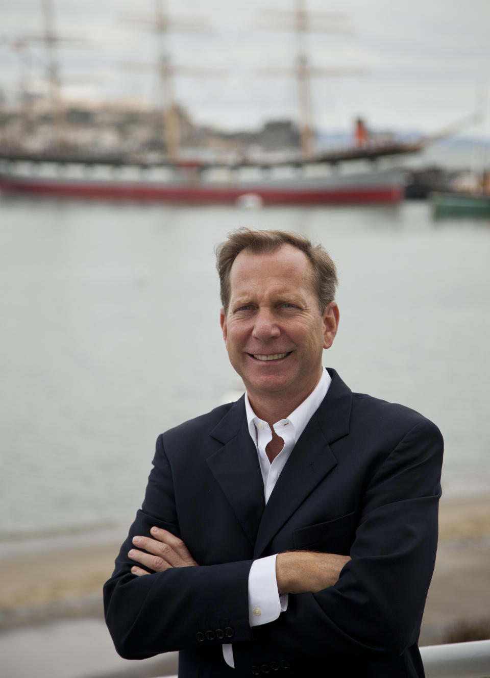 In this photo taken Thursday, Oct. 25, 2012, Michael Ellis, the new worldwide director of Michelin Guide, poses at Aquatic Park near Fisherman's Wharf in San Francisco. Ellis took over this year as head of the guides, becoming the first U.S.-born (and first non-Frenchman) to head the Michelin Guide. (AP Photo/Eric Risberg)