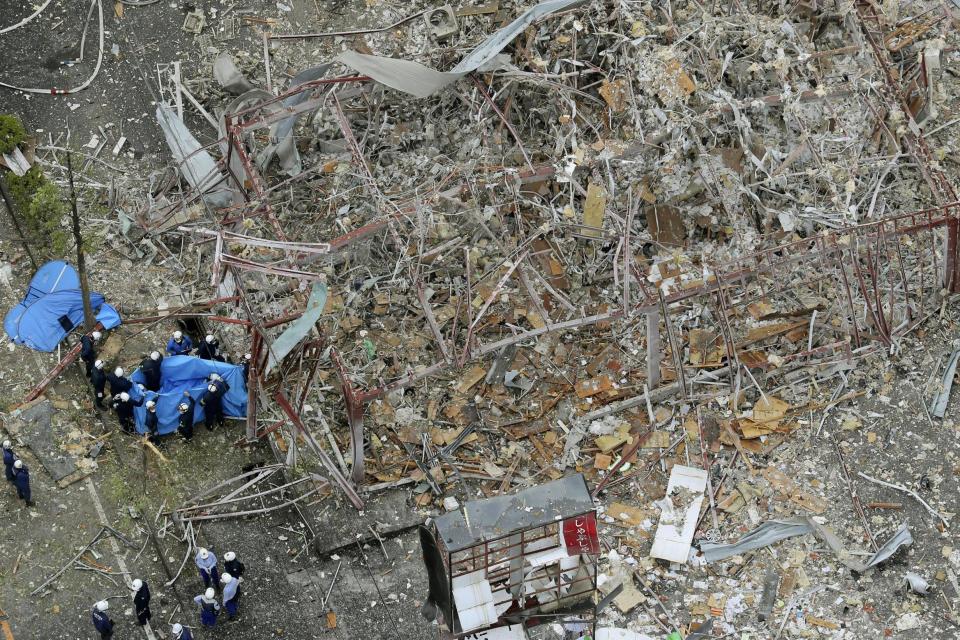 'Gas blast': Investigators work at the scene of an explosion in Koriyama, northern Japan: AP