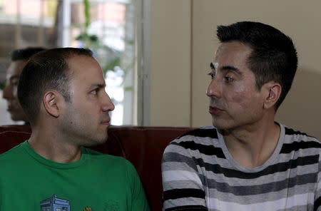 Christian Zamora (R) and Gerald Castro, a same-sex couple, speaks at their house in San Jose June 3, 2015. REUTERS/Juan Carlos Ulate