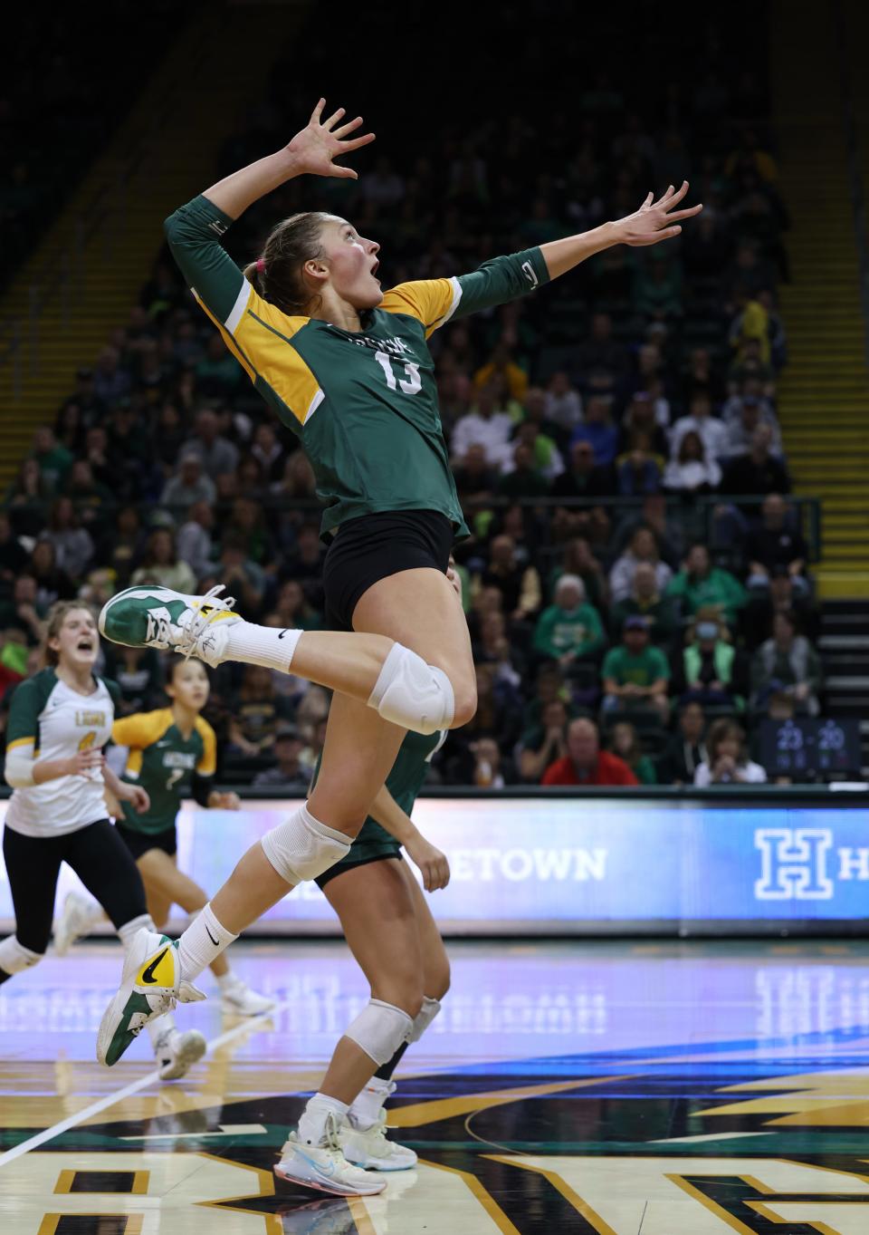 Brooke Bultema, an Ursuline senior, jumps high for a kill attempt. Ursuline Academy defeated Magnificat, 3-1, on Nov. 12 at the Wright State's Nutter Center to earn the Division I state volleyball championship.