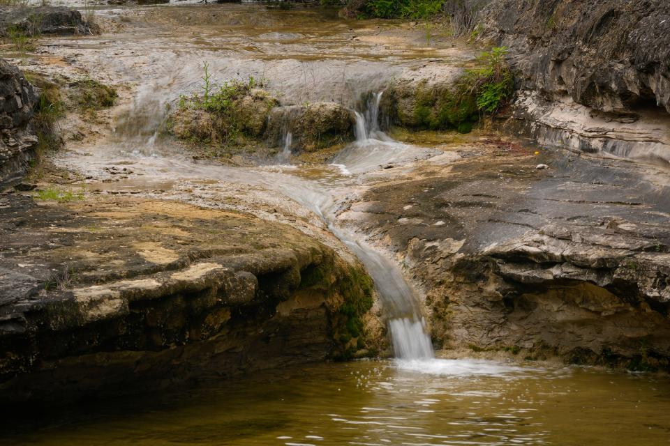 Rocky inclines lead to the spring-fed waters of Bee Creek.