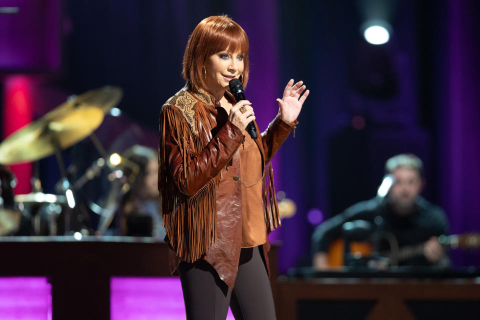 <p>Reba McEntire rocks a new look on Sept. 13 during Loretta Lynn's Friends: Hometown Rising, held at Nashville's Grand Ole Opry. All proceeds from the charity concert benefit the <a href="http://www.unitedwayhumphreys.org/" rel="nofollow noopener" target="_blank" data-ylk="slk:United Way of Humphreys County;elm:context_link;itc:0;sec:content-canvas" class="link ">United Way of Humphreys County</a> to help those affected by <a href="https://people.com/human-interest/tennessee-floods-flooding-death-toll-dozens-missing/" rel="nofollow noopener" target="_blank" data-ylk="slk:the historic flooding;elm:context_link;itc:0;sec:content-canvas" class="link ">the historic flooding</a> in the area last month.</p>