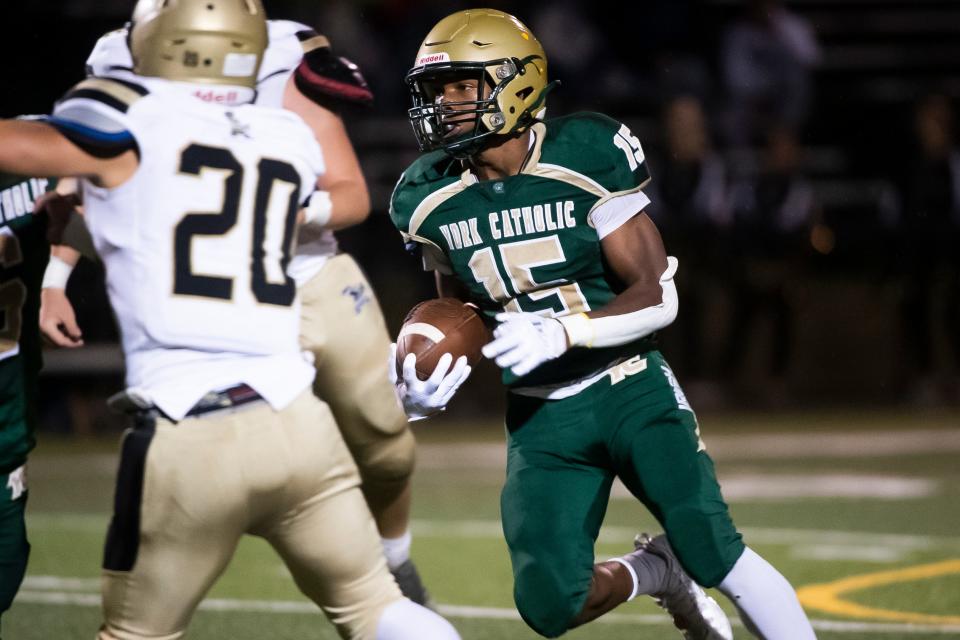 York Catholic's LeVan McFadden runs for a 9-yard touchdown during a YAIAA Division III football game against Delone Catholic at York Catholic Stadium on Friday, September 30, 2022.