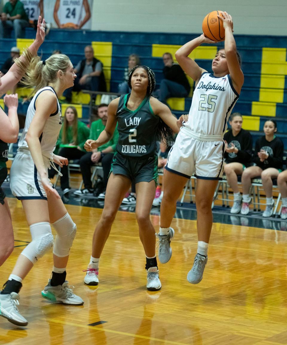 Gulf Breeze High School's Jayah Jons (No. 25) puts up two points against the Northview Academy's defense during the Innisfree Hotels Beach Basketball Tournament on Friday, Dec. 29, 2023.