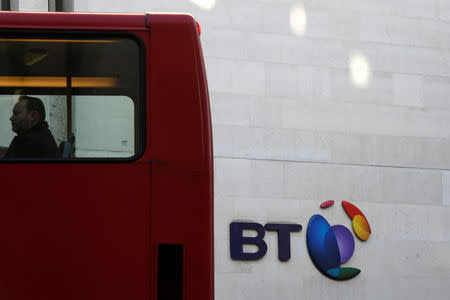 FILE PHOTO: A bus passes a BT logo outside of offices in the City of London, Britain, January 24, 2017. REUTERS/Toby Melville/File Photo