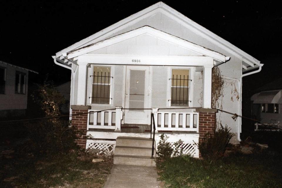 Photographs of the small, white bungalow at 6934 S. Benton Ave., where the murders unfolded, remain in police files today.