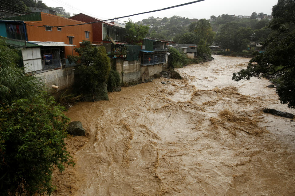 <p>The flooded Tiribi river is seen during heavy rains of Tropical Storm Nate that affects the country in San Jose, Costa Rica, Oct. 5, 2017. (Photo: Juan Carlos Ulate/Reuters) </p>