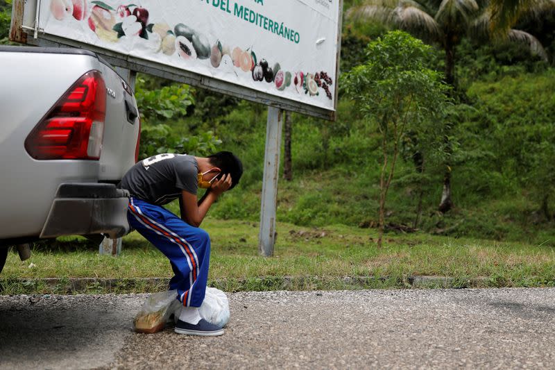 Gustavo, a disabled 12-year-old who was expelled by U.S. authorities to Guatemala under an emergency health order, cries after refusing to hold a phone conversation with his mother Elida during his reunion with his father Juan, in Peten