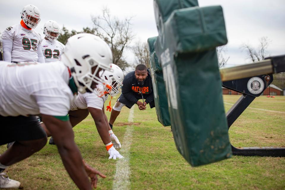 FAMU defensive line coach Milton Patterson watches as players prep to hit the sled during the first football practice of the year Wednesday, March 3, 2021.