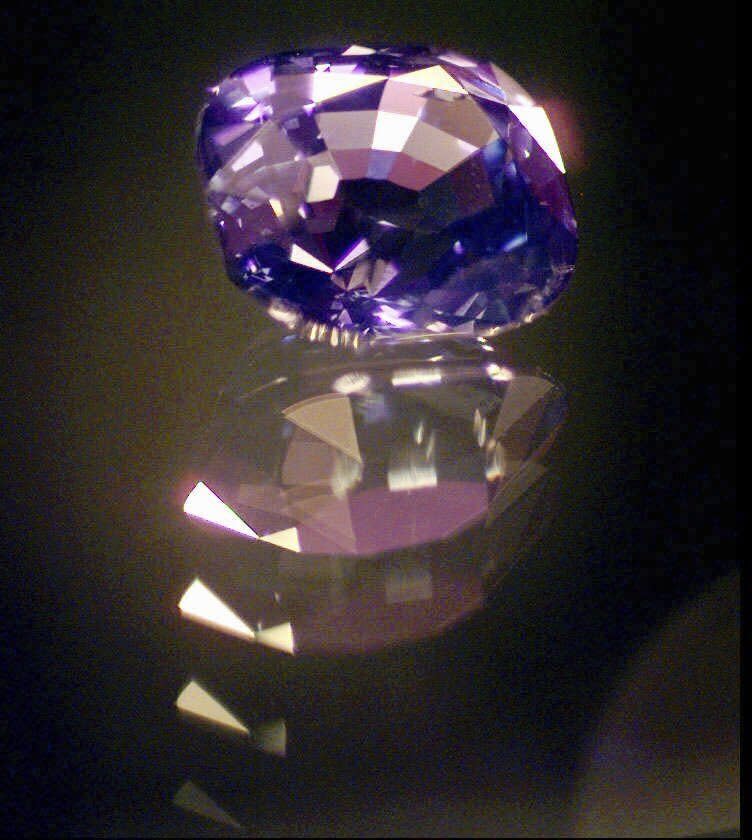 FILE - An 8.8 carat purple sapphire appears at John Marshall's jewelry shop in South Bend, Ind., May, 1, 1998. (AP Photo/Jim Rider, File)