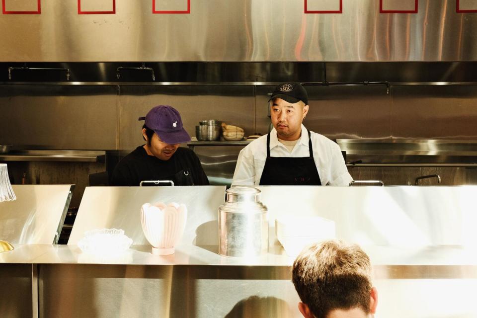 Chef Wedchayan "Deau" Arpapornnopparat prepares lunch behind the counter of his Atwater Village location of Holy Basil