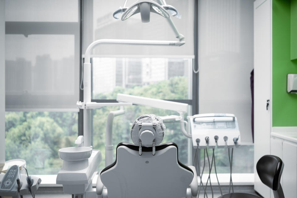Dental office with modern chair and equipment, no persons in image
