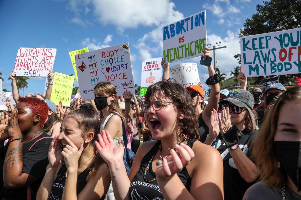 Palm Beach County Resident Ella Reiss shouts and applauds during a Bans Off Our Bodies abortion rights protest at Clematis Street and Flagler Drive in West Palm Beach, Saturday, October 2, 2021.  