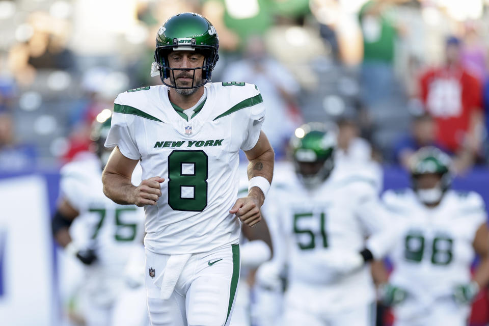 New York Jets quarterback Aaron Rodgers (8) takes the field before an NFL preseason football game against the New York Giants, Saturday, Aug. 26, 2023, in East Rutherford, N.J. (AP Photo/Adam Hunger)