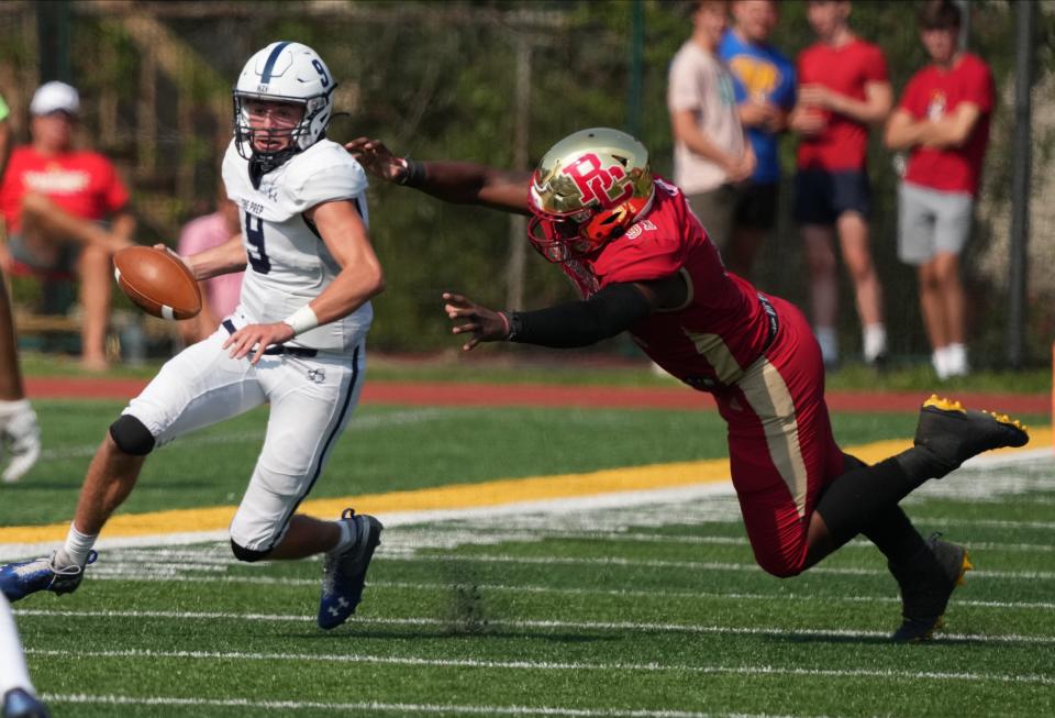 Quarterback Liam Londergan of Seton Hall Prep avoids Elijah Kinsler of Bergen Catholic in the second half as number five Seton Hall Prep came to Oradell, NJ to take on top ranked Bergen Catholic on September 17, 2022.