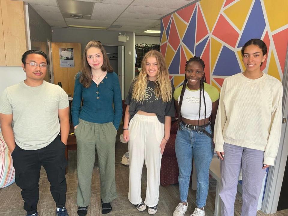 Team members at Communities Building Youth Futures in Yellowknife recently surveyed students about their high school experience. They include coordinator Narlie Dapilos, left, Desiree Pitt, Ava Applejohn, Crystal Kisakye and Yazmin MacIntosh. (Loren McGinnis/CBC - image credit)