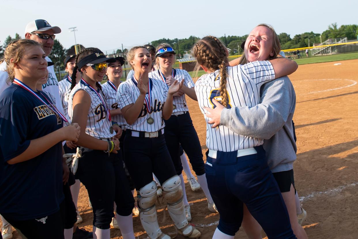 Littlestown's Ashlynn Gorsuch (8) gets a hug on the field after winning the YAIAA softball championship at Spring Grove Area School District on May 17, 2023. The Bolts defeated South Western, 1-0, in eight innings.