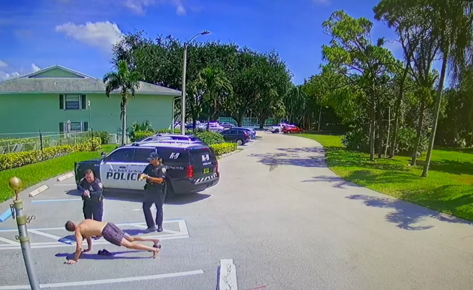 Surveillance-camera footage at Sabal Ridge apartment complex shows former Palm Beach Gardens police officer Bethany Guerriero aim a gun at a man who called 911 to report a crime on Tuesday, May 9, 2023. City officials fired Guerriero after a review of the incident.