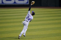 Colorado Rockies' Ryan McMahon (24) catches a fly out hit by Arizona Diamondbacks' David Peralta during the second inning of a baseball game, Saturday, Sept. 26, 2020, in Phoenix. (AP Photo/Matt York)