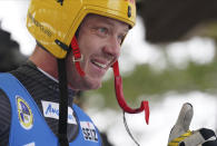 Felix Loch of Germany reacts after he placed second in the Luge World Cup race in Sigulda, Latvia, Saturday, Jan. 8, 2022. (AP Photo/Roman Koksarov)