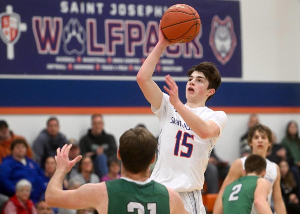 Saint Joseph’s Michael Lower shoots for a basket over Juniata Valley defenders during the game on Wednesday, Feb. 1, 2023.