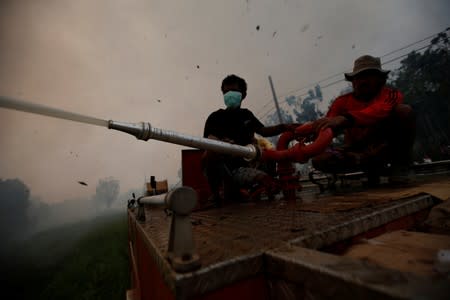 The Wider Image: Indonesia's firefighters on frontline of Borneo's forest blazes