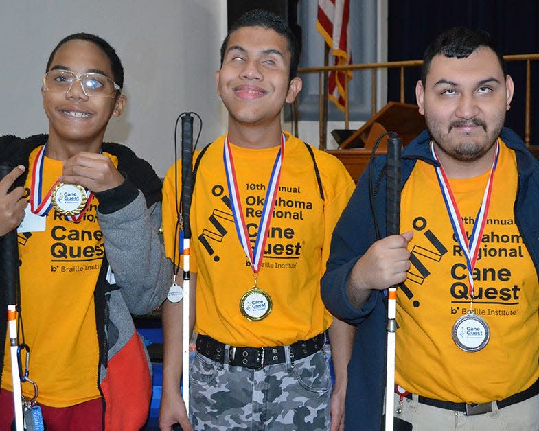 Oklahoma School for Blind students from Oklahoma City earned medals at OSB’s Oklahoma Regional Cane Quest competition (from left): Quanté Sellers, Julio Valdez and Elbin Carrillo.