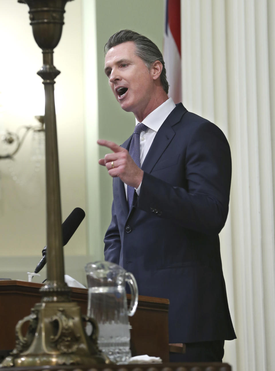 In this Tuesday, Feb. 12, 2019 photo, California Gov. Gavin Newsom delivers his first state of the state address to a joint session of the legislature at the Capitol in Sacramento, Calif. Newsom said the state's consumers should get a "data dividend" from technology companies, like Google and Facebook, who are make by capitalizing on the personal data they collect. (AP Photo/Rich Pedroncelli)