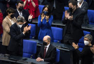 Olaf Scholz of the Social Democrats receives applause from lawmakers after he was elected new German Chancellor in the German Parliament Bundestag in Berlin, Wednesday, Dec. 8, 2021. The election and swearing-in of the new Chancellor and the swearing-in of the federal ministers of the new federal government will take place in the Bundestag on Wednesday. (Photo/Stefanie Loos)