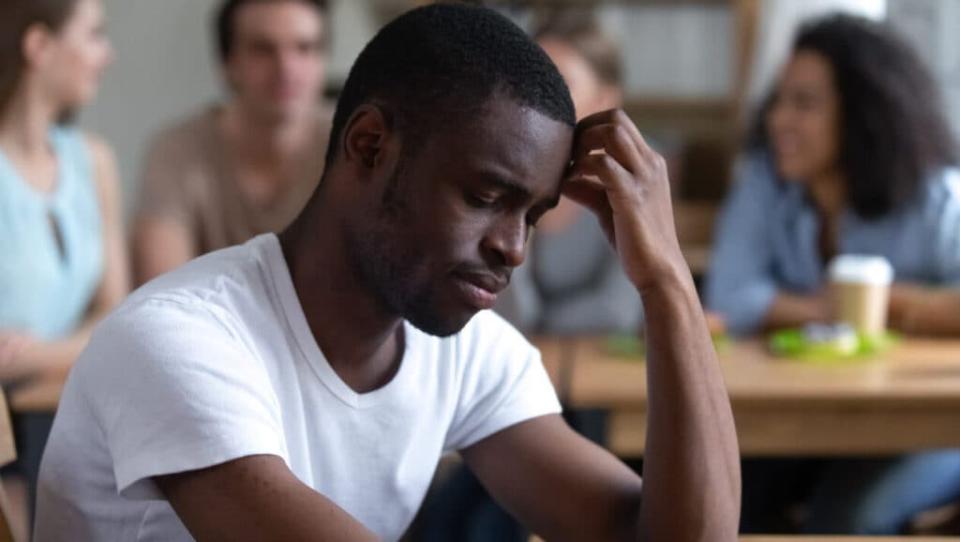 Sad Black man in classroom