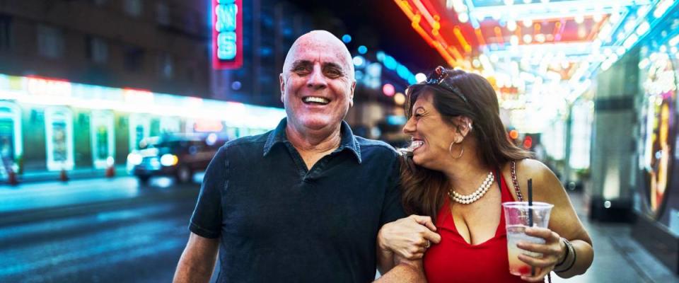 mature couple sightseeing in downtown las vegas streets