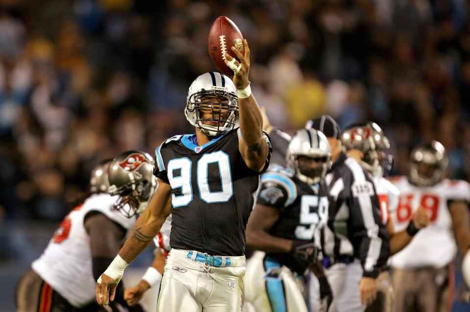 Julius Peppers of the Carolina Panthers celebrates after recovering a fumble during their game against the Tampa Bay Buccaneers on November 13, 2006 at Bank of America Stadium in Charlotte, North Carolina.