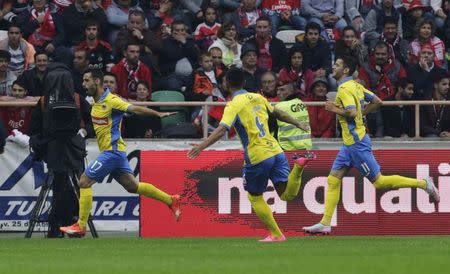 Arouca's Roberto Rodrigo (L) celebrates his goal against Benfica with his teammates Lucas Lima (C) and Ivo Rodriguez during their Portuguese Premier League soccer match at Municipal stadium in Aveiro, August 23, 2015. REUTERS/Miguel Vidal