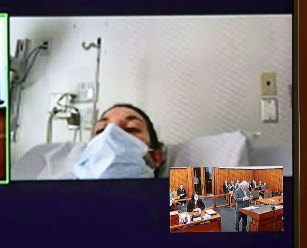 PHOTO: In this video screen image, Lindsay Clancy with a surgical mask over her face in a hospital appears during her arraignment on charges regarding her three children's deaths at Plymouth District Court, Feb. 7, 2023, in Plymouth, Mass. (David Ryan/The Boston Globe via AP)