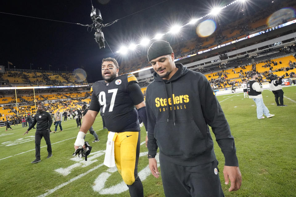 Pittsburgh Steelers defensive tackle Cameron Heyward, left, and Pittsburgh Steelers safety Minkah Fitzpatrick, right, walk off the field after an NFL football game against the Cincinnati Bengals, Saturday, Dec. 23, 2023, in Pittsburgh. The Steelers won 34-11. (AP Photo/Gene J. Puskar)