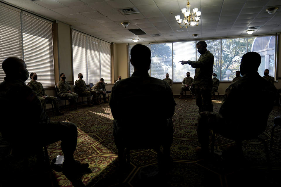 Sergeant Major of the Army Michael Grinston, center, gets feedback from soldiers about their concerns at Fort Hood, Texas, Thursday, Jan. 7, 2021. Following more than two dozen soldier deaths in 2020, including multiple homicides, the U.S. Army Base is facing an issue of distrust among soldiers. (AP Photo/Eric Gay)