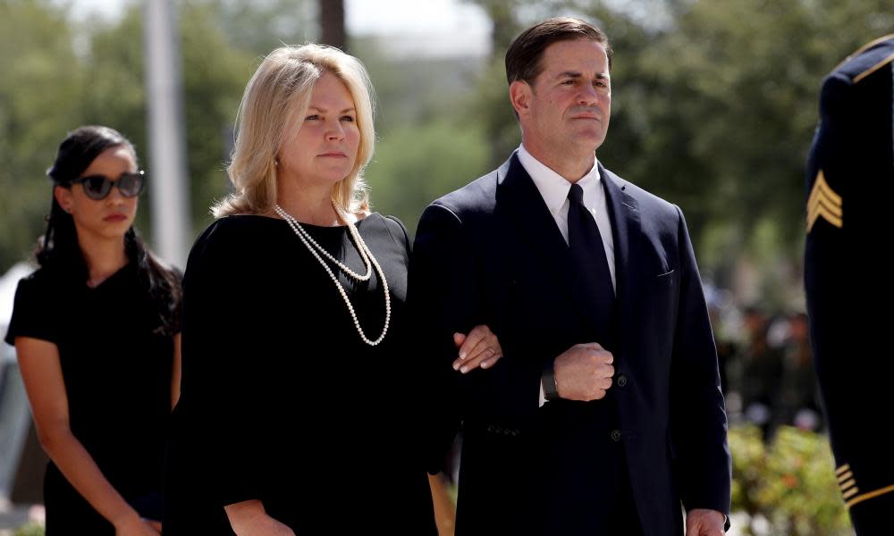 Governor Doug Ducey of Arizona and his wife Angela Ducey, at a memorial service for Senator John McCain in Phoenix on Wednesday. Ducey must name a replacement to fill McCain’s Senate seat.