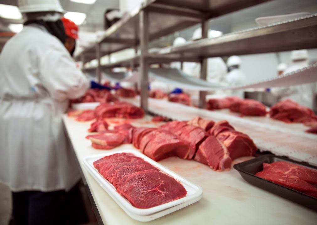 Meats of all types sit raw before packaging.