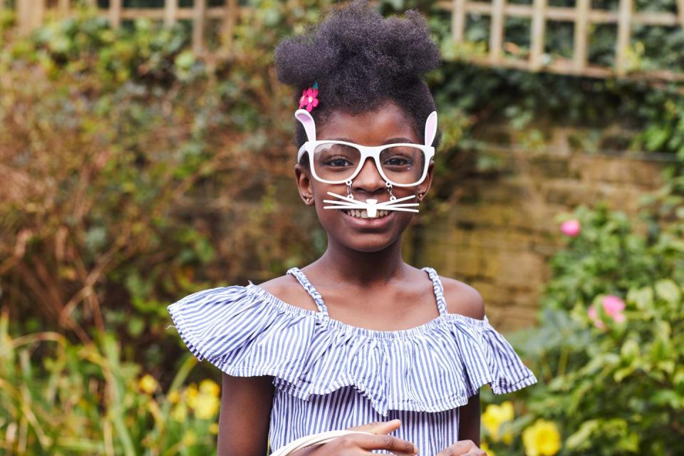 child wearing easter bunny glasses in the sun