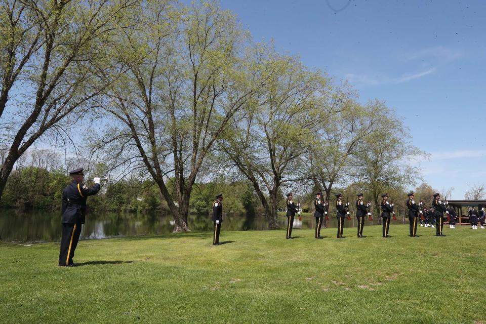 Taps is played after a 21 gun salute by the Akron Police Honor Guard during the Akron Police Memorial Day ceremony at the Fraternal Order of Police Akron Lodge 7 on Wednesday. 
