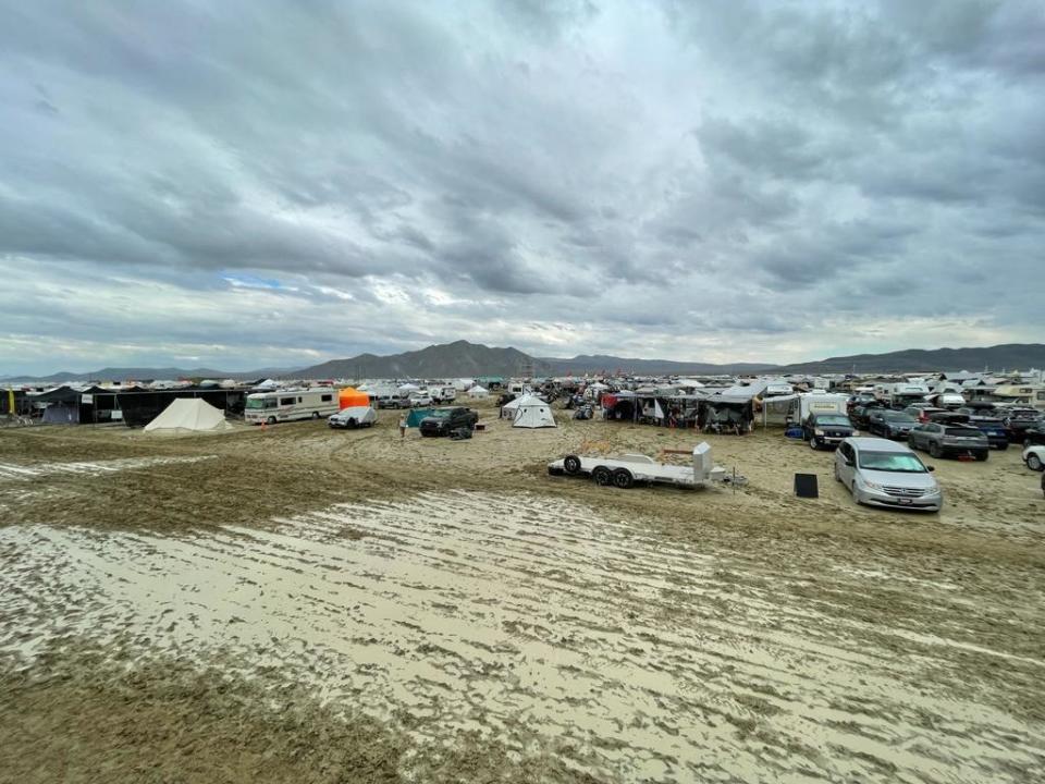 Camps are set on a muddy desert plain on Sept. 2, 2023, after heavy rains turned the annual Burning Man festival site in Nevada's Black Rock desert into a mud pit.  / Credit: JULIE JAMMOT/AFP via Getty Images