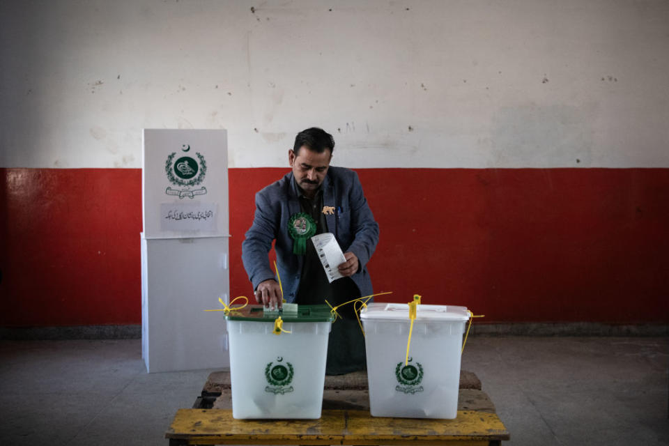 A Pakistani voter casts their ballot during polling for Pakistan’s general election at a polling station on February 8, 2024, in Wahgrian, Pakistan. (Photo by Rebecca Conway/Getty Images)