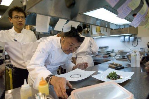 Local celebrity chef Justin Quek prepares a dish in the kitchen of his high-end restaurant Sky on 57 on the top floor of the Marina Bay Sands integrated resort in Singapore. Spurred by economic development and the opening of its two casino complexes, Singapore is beginning to compete with more established culinary capitals like Tokyo and Hong Kong with its western and fusion fare