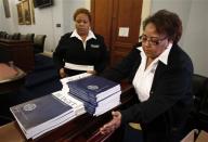 U.S. Government Printing Office employees deliver copies of President Barack Obama's Fiscal Year 2015 Budget to The House Budget Committee on Capitol Hill in Washington, March 4, 2014. REUTERS/Yuri Gripas