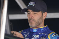 FILE - Jimmie Johnson sits in his pit box before the final practice for the Indianapolis 500 auto race at Indianapolis Motor Speedway, Friday, May 27, 2022, in Indianapolis. Jimmie Johnson announced Friday, Sept. 9, 2022, that sponsor Carvana has agreed to fund next year's racing endeavors and the seven-time NASCAR champion will use the next few weeks to determine his 2023 schedule.(AP Photo/Darron Cummings, File)