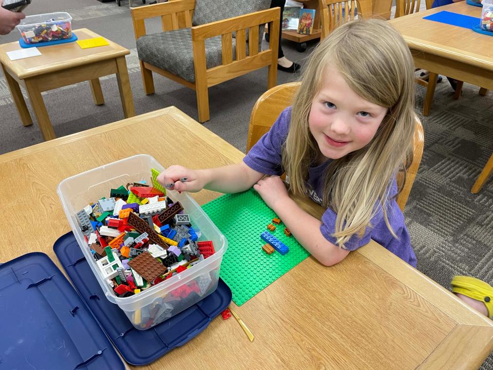 Lydia Jerviss, 6, has a build underway, but she said she’s not quite sure what it is yet at the monthly LEGO Club at Karns Branch Library Saturday, May 21, 2022.