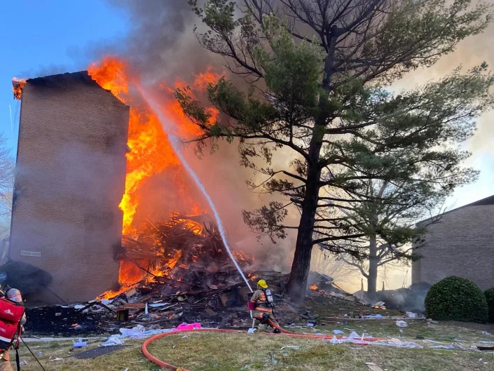 Flames billow out of an exploded apartment block in Silver Spring, Montgomery County, Maryland