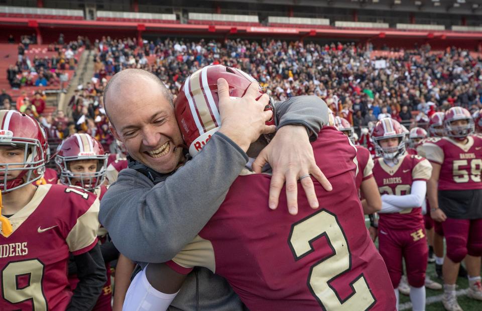 Hillsborough coach Kevin Carty hugs Thomas Amankwaa as the clock ticks down during the South Group 5 regional championship game on Saturday, Dec. 4, 2021 at Rutgers.